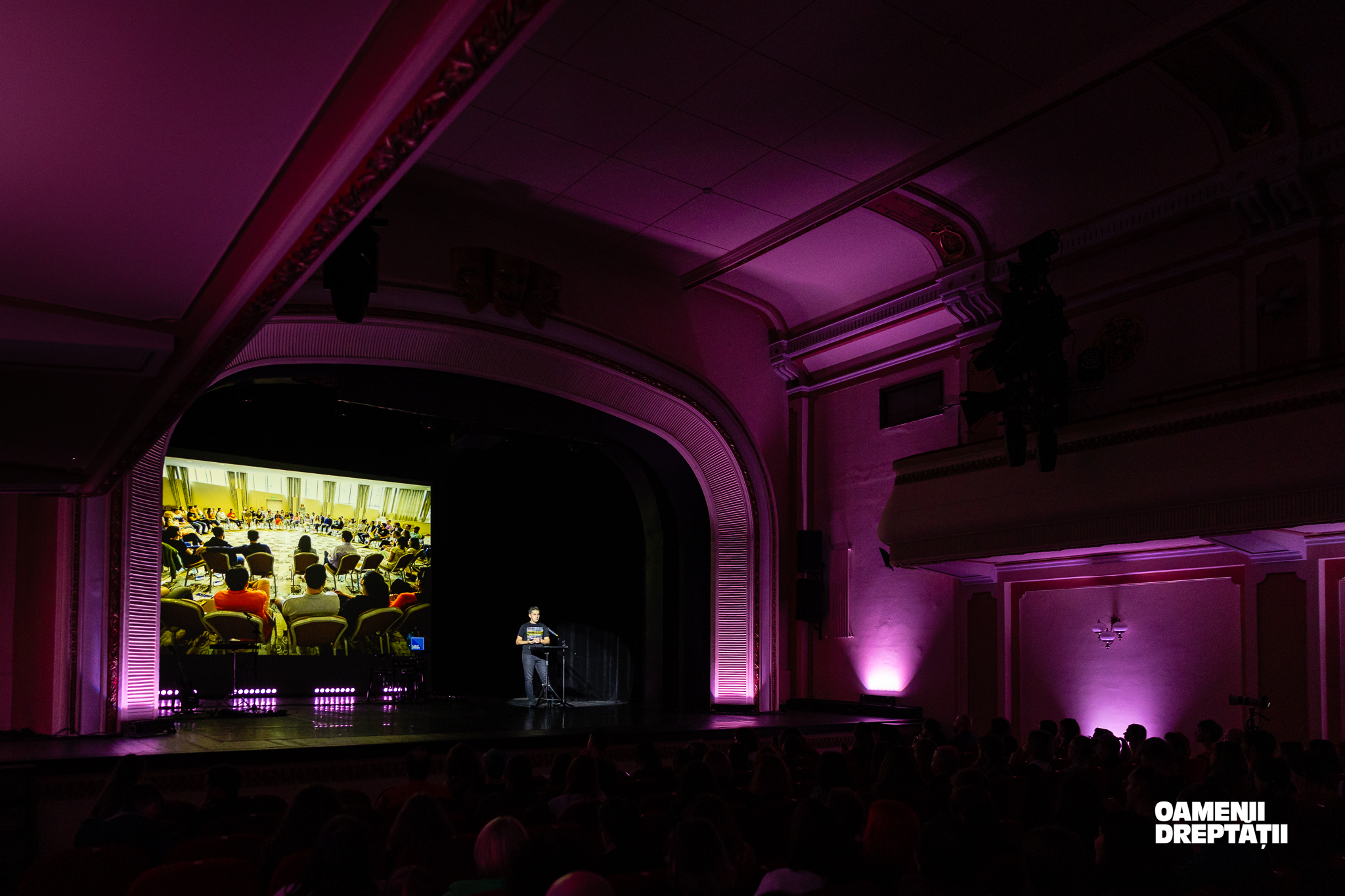 Stage photographed from the back of the room at Oamenii Dreptății in Brașov.
